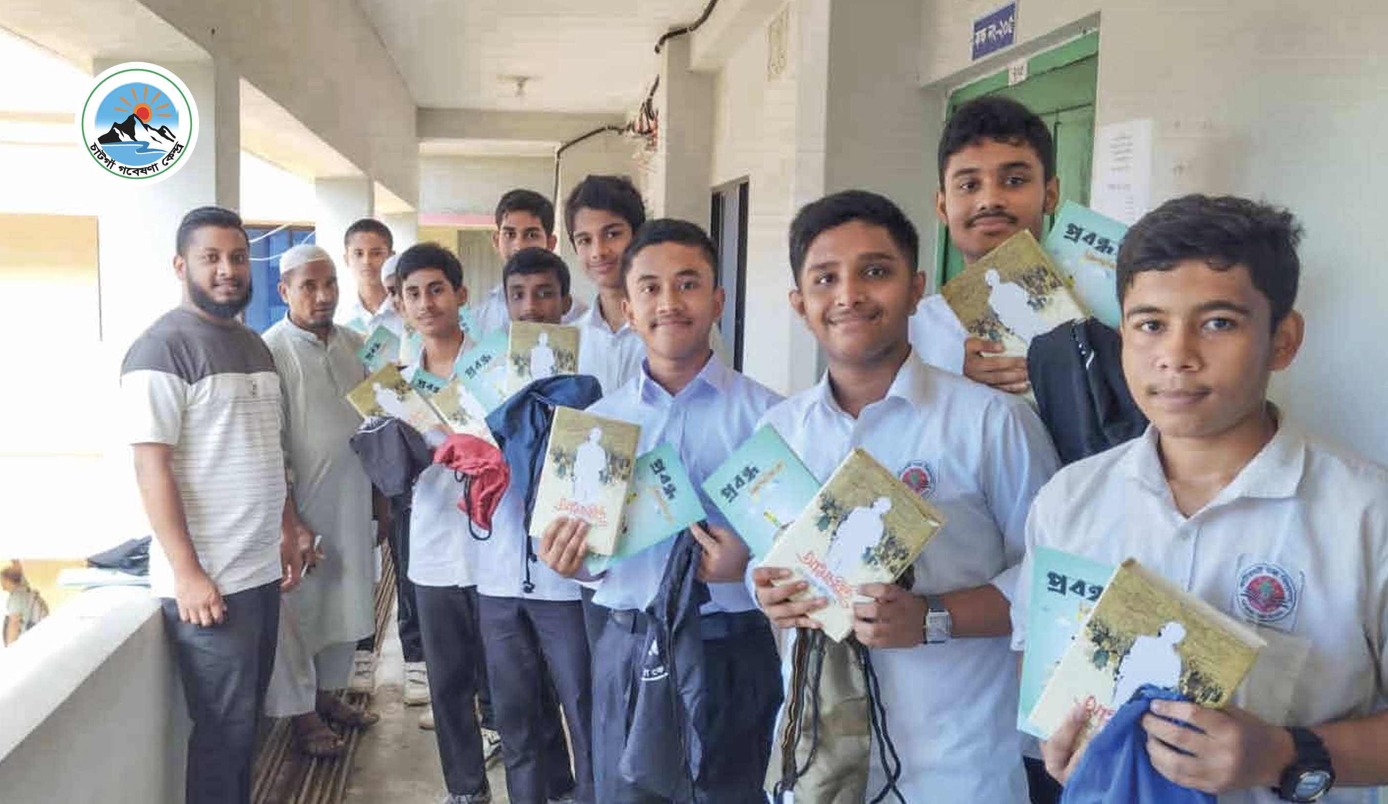Students holding Anwesha booklets
